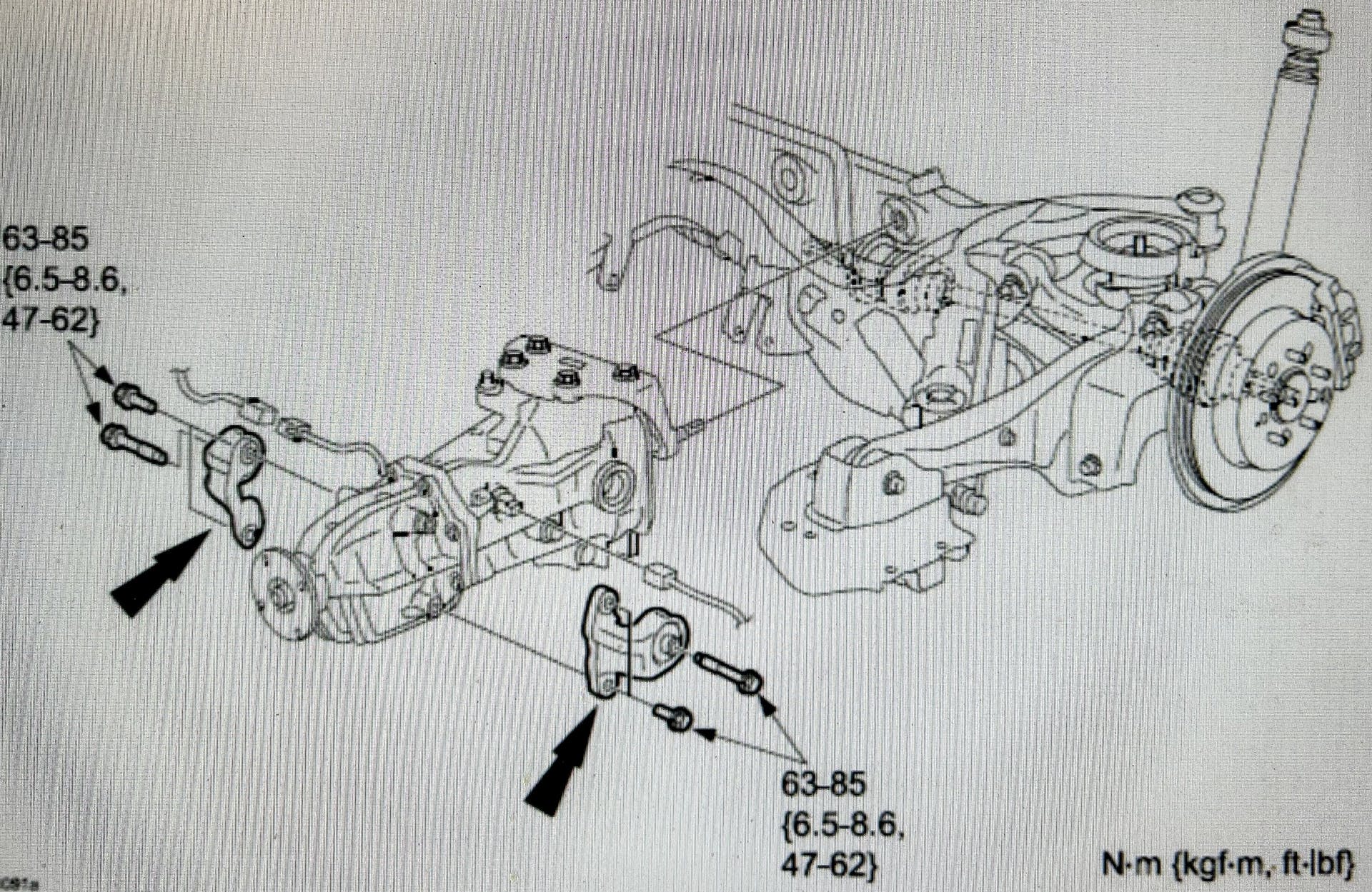 Note the location of the rear differential mounting rubbers. Torque the mounting screws to 47- 62 ft.-lb.