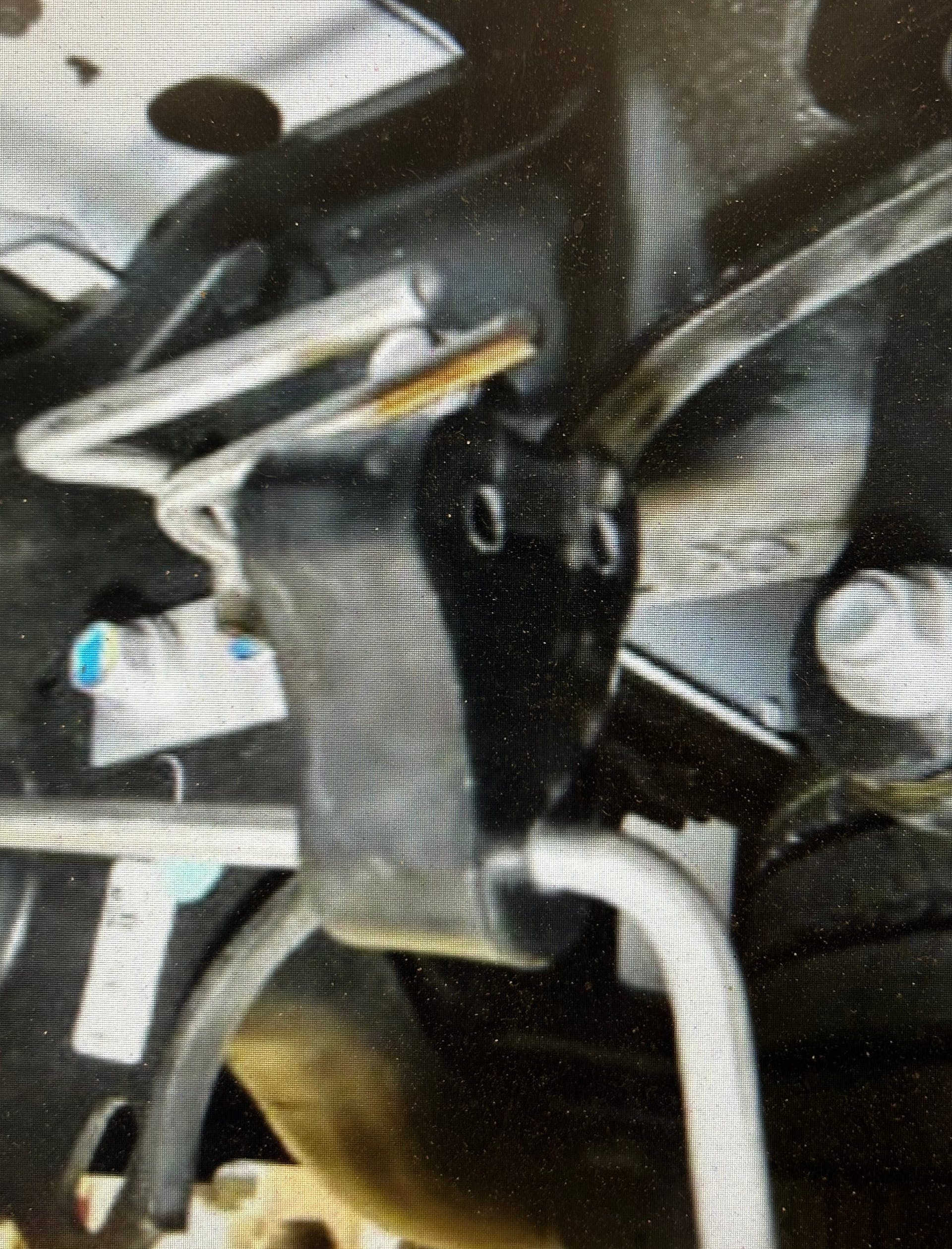 Example of rubber isolator separated from the hanger. Note the smooth hanger legs.