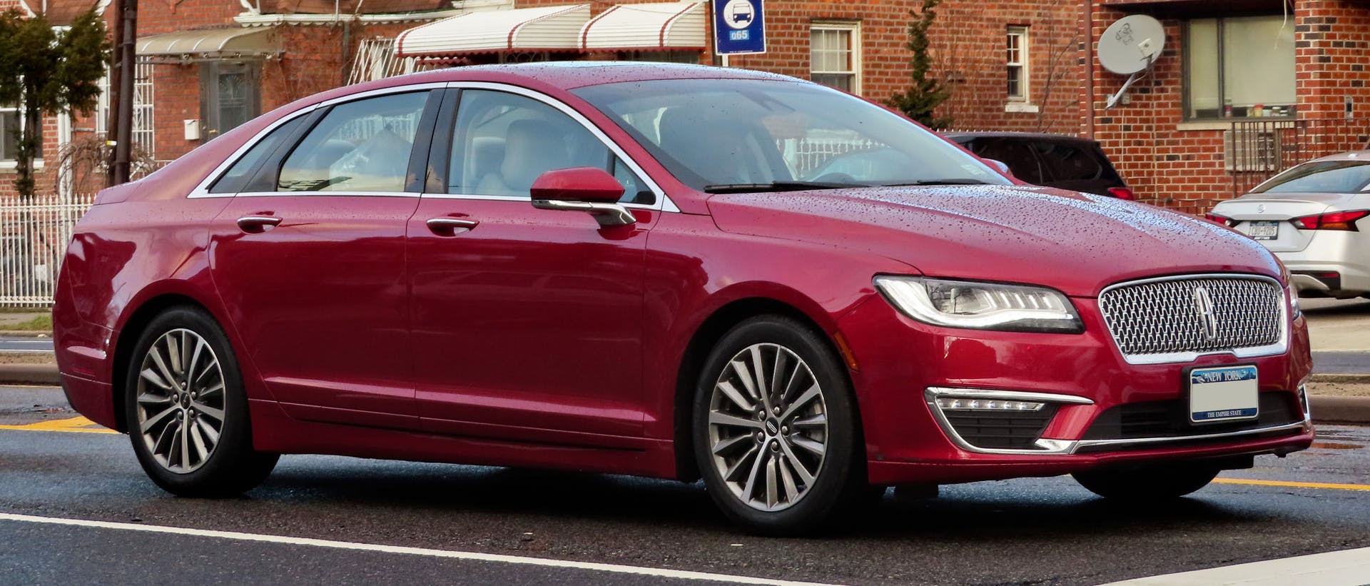 This may be due to an exhaust system leak. Exhaust leak inspection should be conducted before performing powertrain control/emissions diagnostics.