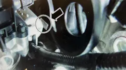 The tag can be seen to the right of the throttle body.