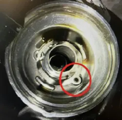 Replace the rubber oil drain plug and spring.