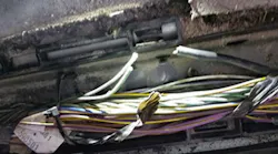 Example of damaged wires under the driver's sill plate.