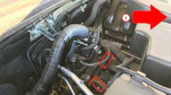 Cam sensor locations (see red rectangles). An arrow indicates the vehicle front.