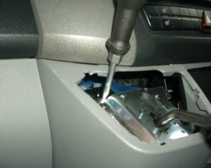 With the lever cover removed, push the sliding piece down. If it springs back, the shifter is adjusted.