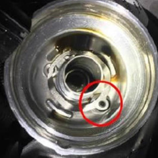 An improved rubber plug and spring is available for the oil filter housing.