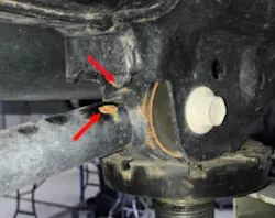 Example of contact between the right lower control arm and the support bracket. Example of contact between the right lower control arm and the support bracket.