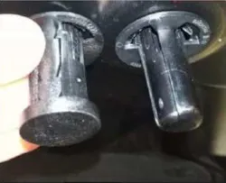 Do not compress the striker pin before installation. Use a socket or other applicable tool to push the striker plate onto the hood.