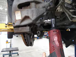 Figure 5 – I use a Milwaukee 3/8” drive 12V battery-powered ratchet to remove the caliper to bracket hardware.