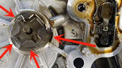 Inspect for damaged vacuum pump drive lugs (damaged example shown here).
