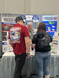 Radians chatting with distributors about the products on display in their booth. Radians chatting with distributors about the products on display in their booth.