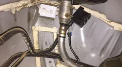 Disconnect the air inlet pipe from the EVAP canister. Remove the cover from the air inlet housing.