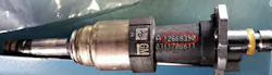 Pay attention to the part number shown on the removed injector. The top row of numbers in this example indicates the injector part number (in this example, the P/N is A12668390).