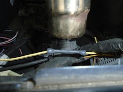 Figure 3 — This image shows how heat is applied first to the center of the shrink tube, working towards the outer edges. Figure 3 — This image shows how heat is applied first to the center of the shrink tube, working towards the outer edges.