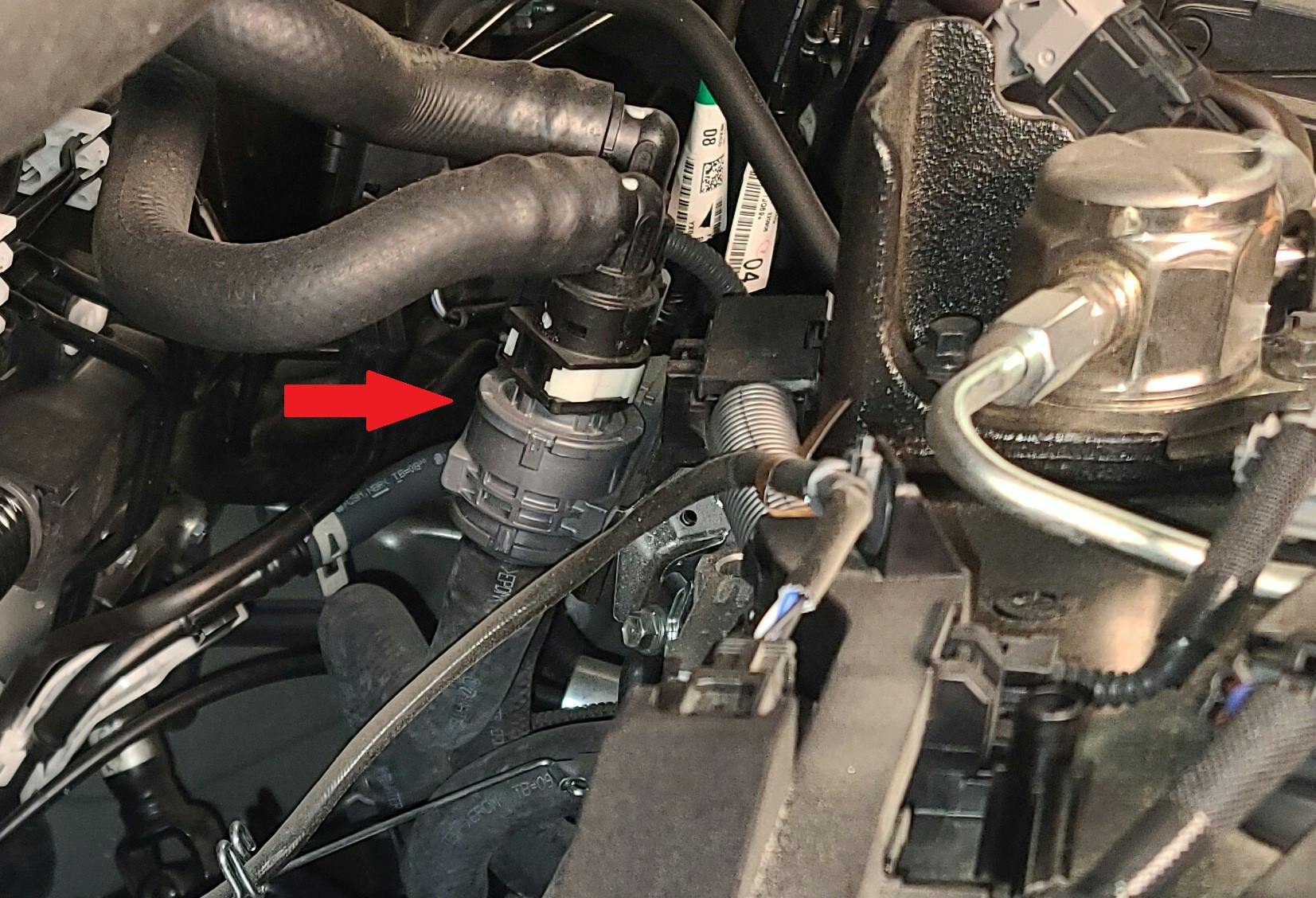 This photo shows the heater core Flow Shutting Valve (FSV1). It is a magnetically controlled valve that will regulate when coolant can flow through the heater core.