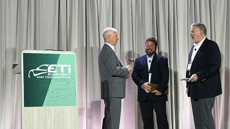 Previous ETI President David Rich (middle) handing off the gavel to the current ETI President Bob Augustine (left).