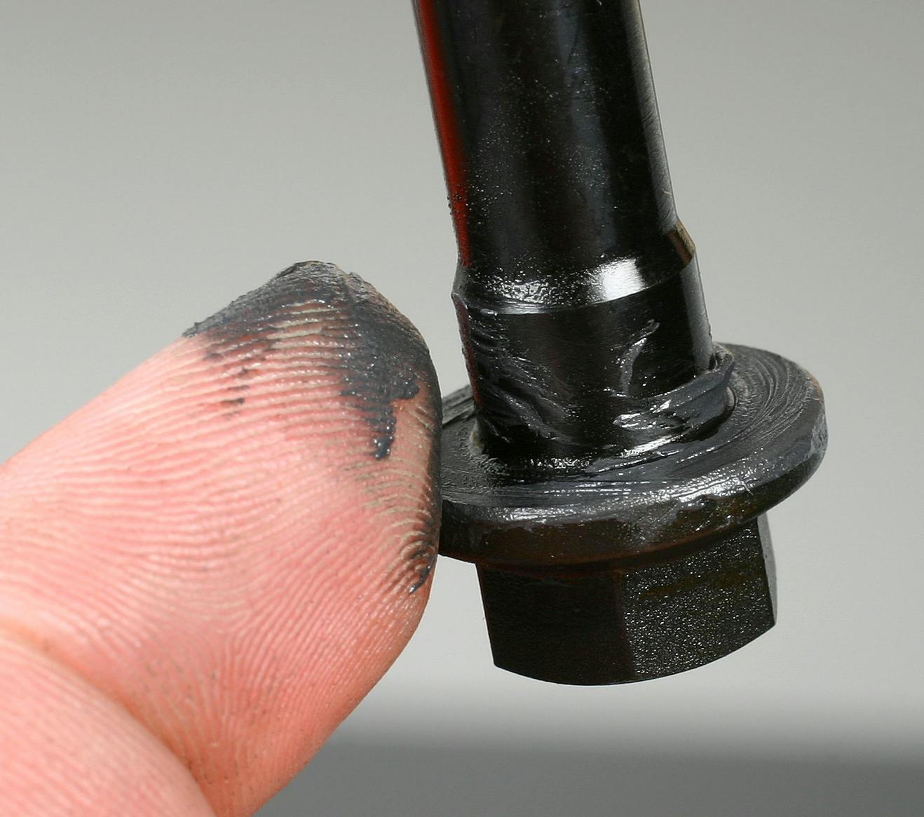 Always refer to vehicle service manual instructions with regard to threaded fastener lubrication, as some bolts or nuts require a lubricant (engine oil or other specific lube), some require thread sealant, some require a thread locking compound and others require dry installation. The nature of thread prep will be specific to the application. If lubricant is required (for instance on cylinder head bolts or connecting rod bolts), lube must be applied to both threads and to the underside of the bolt heads. Aftermarket performance fasteners for cylinder head, main cap and rod bolt applications may recommend a specific brand/type of lubricant.