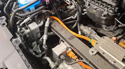 With the trim panels removed you can see all the extra plumbing involved in this heat pump equipped 2023 Hyundai IONIQ 6, this illustrates the need to follow the diagnostics to remove or service the A/C system.
