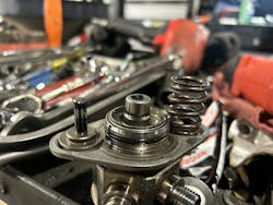 Figure 7: On the left of the HPFP you can see the HPFP rod, and on the right, you can see the spring. In the middle, you can see the hole where seven gallons of fuel drained out of the high-pressure system. Figure 7: On the left of the HPFP you can see the HPFP rod, and on the right, you can see the spring. In the middle, you can see the hole where seven gallons of fuel drained out of the high-pressure system.