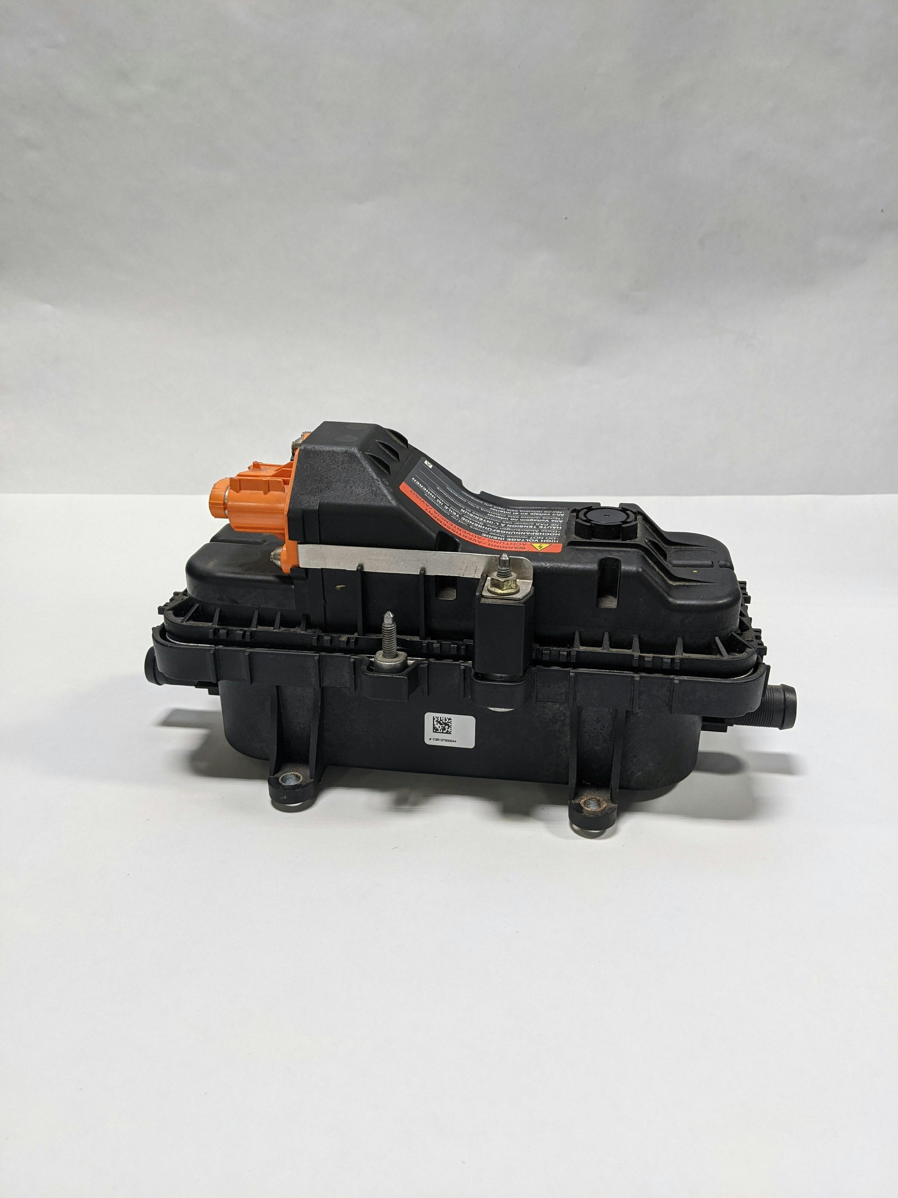 When PHEVs first came to market in North America, they all bought the same HV heater from a German company, with various attachment points and connectors. To provide cabin heat, a 1-gallon container (ACDC estimate) of coolant was heated using the high voltage battery for power, and that hot coolant was circulated in and out of the heater core with a 12-volt pump.