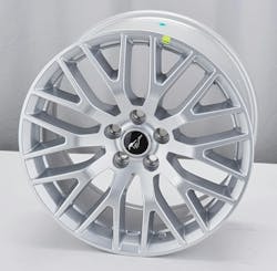 Example of an aftermarket alloy wheel. Note the yellow sticker. This indicates the wheel’s low runout point. Example of an aftermarket alloy wheel. Note the yellow sticker. This indicates the wheel’s low runout point.