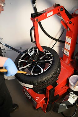 Tire being mounted. Notice the yellow tire dot aligned to the valve stem, matching the tire’s light spot to the wheel’s heavy spot. Tire being mounted. Notice the yellow tire dot aligned to the valve stem, matching the tire’s light spot to the wheel’s heavy spot.