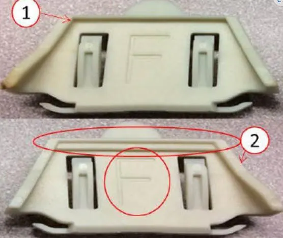 Door glass clip comparison. 1) Old style clip. 2) New style clip.