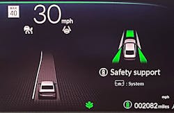 The data that the forward-facing camera has recorded and is using for its lane-keeping system is displayed in this dashboard image from a 2024 Honda Accord. The centre line, displayed as a white line, is the sole visible or dependable road marking, and the road turns to the left. It also displays the speed limit and shows that the lane keep system is currently deactivated (shown by the small white steering wheel icon) because there is insufficient data for it to function correctly. The data that the forward-facing camera has recorded and is using for its lane-keeping system is displayed in this dashboard image from a 2024 Honda Accord. The centre line, displayed as a white line, is the sole visible or dependable road marking, and the road turns to the left. It also displays the speed limit and shows that the lane keep system is currently deactivated (shown by the small white steering wheel icon) because there is insufficient data for it to function correctly.