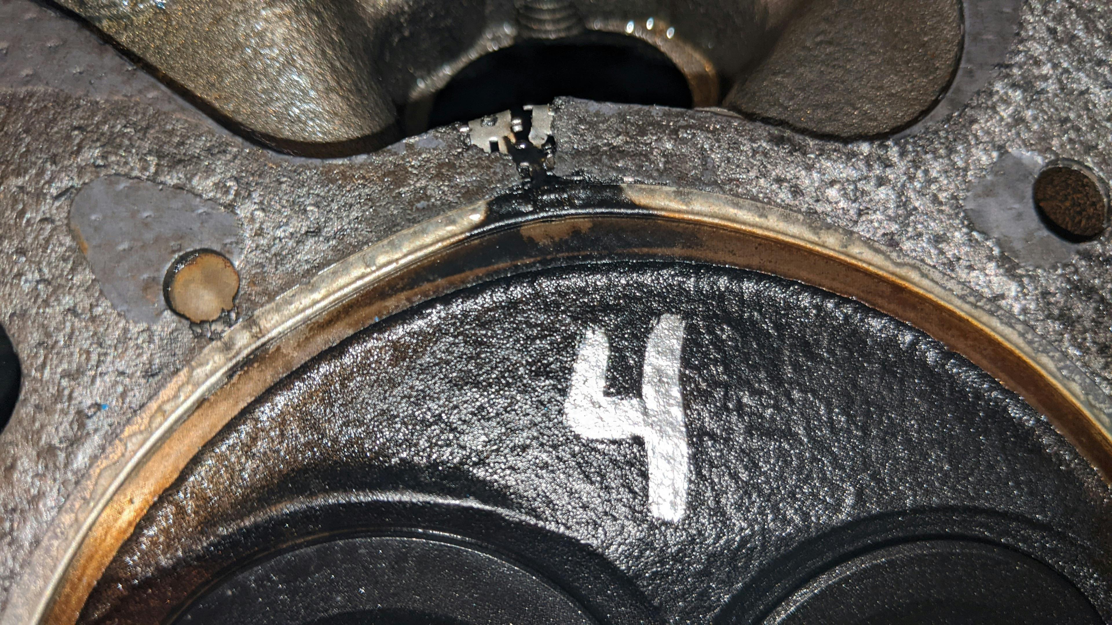 Example of a head gasket failure from the combustion chamber.