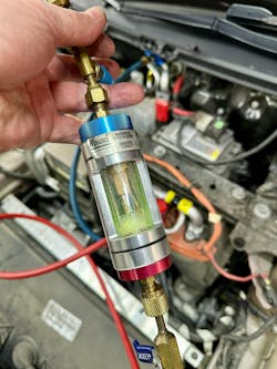 Figure 10 – A/C system sight glass Figure 10 – A/C system sight glass