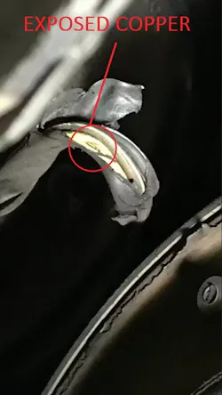Figure 11— The root cause of the fault was discovered to be a chaffed wire contacting the crankshaft balancer in a cyclic fashion as the crankshaft rotated. The balancer provided a path to the ground and loaded the sensor signal, pulling it 'low.' Figure 11— The root cause of the fault was discovered to be a chaffed wire contacting the crankshaft balancer in a cyclic fashion as the crankshaft rotated. The balancer provided a path to the ground and loaded the sensor signal, pulling it 'low.'