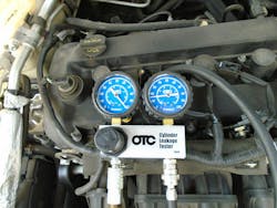 Figure 8 shows the leakdown tester hooked up to cylinder #2. Figure 8 shows the leakdown tester hooked up to cylinder #2.