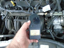 Figure 4 – The Steelman EngineEar II Electronic Stethoscope is positioned to listen to the fuel injector. Figure 4 – The Steelman EngineEar II Electronic Stethoscope is positioned to listen to the fuel injector.