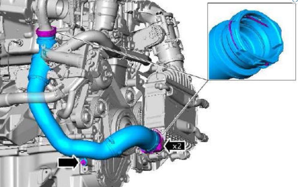 Charge air cooler intake pipe. Note the two retaining clips at the cooler.