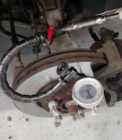 Check brake rotor lateral runout by using a dial indicator. Set up the indicator with about 0.050-inch preload, then zero the gauge. Slowly rotate the rotor while observing the dial, using a marker to indicate the point of highest runout. Perform this check several times to verify. Check brake rotor lateral runout by using a dial indicator. Set up the indicator with about 0.050-inch preload, then zero the gauge. Slowly rotate the rotor while observing the dial, using a marker to indicate the point of highest runout. Perform this check several times to verify.