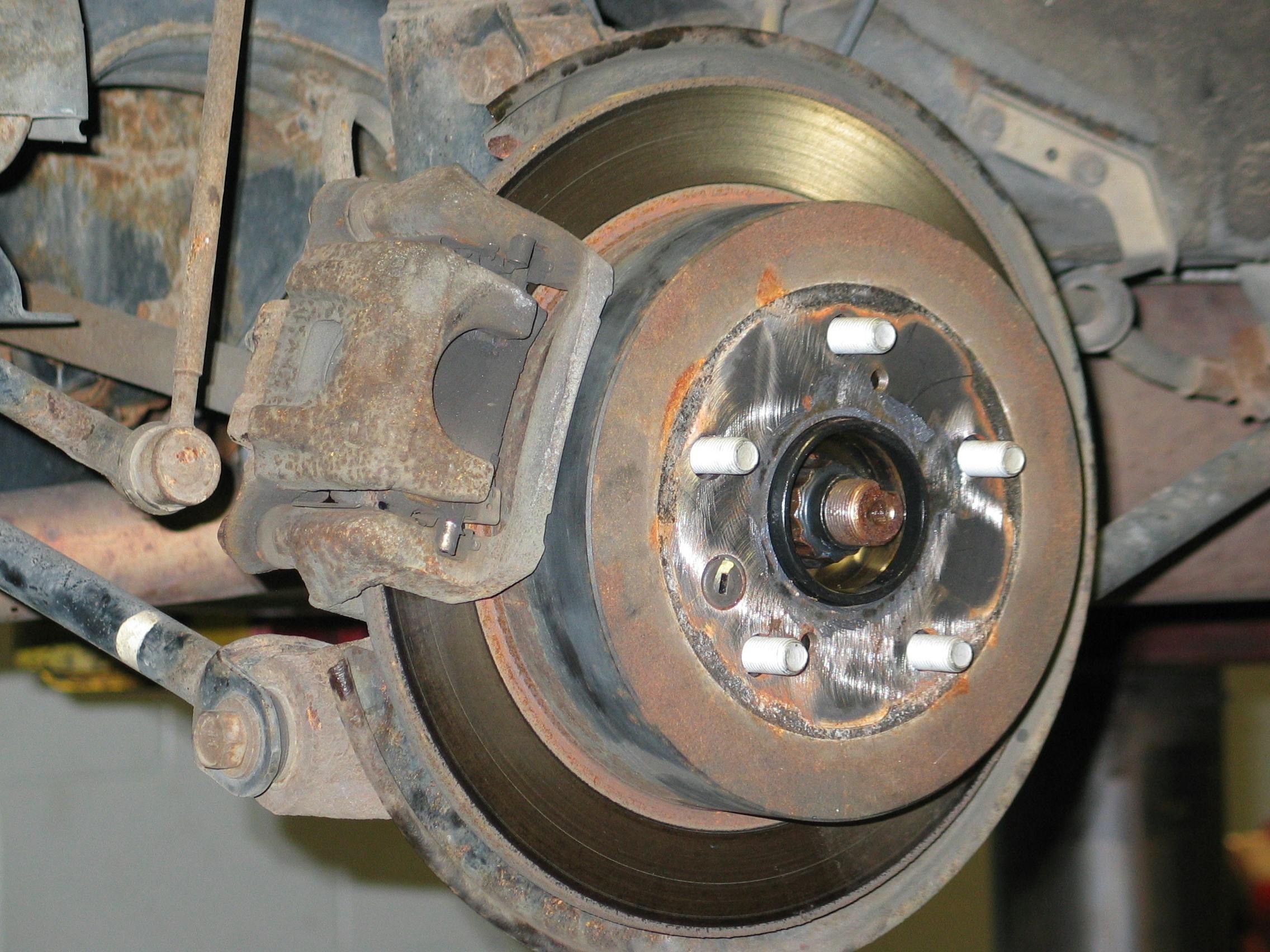 Before installing the wheel, make sure that the mating hub surface is clean and free of rust buildup. However, use care. While a wire brush is safe to use, cleaning the surface with a power tool such as a die grinder with an abrasive disc can create an uneven surface if you get carried away. In an extreme case, this can result in self-imposed lateral wheel runout.