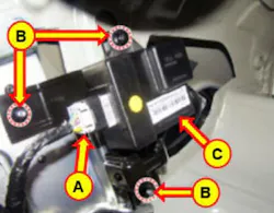Note the location of the FPCM connector (A) and mounting nuts (B).