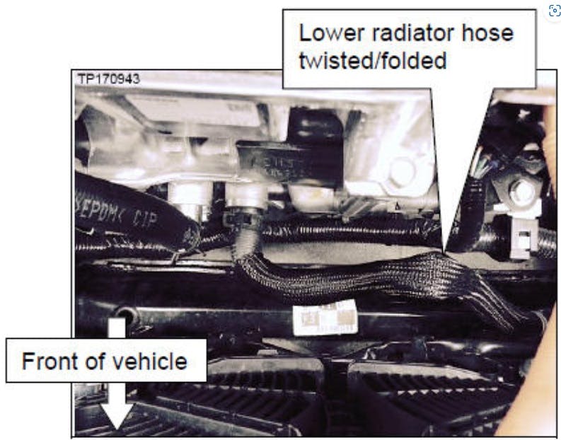 Check the lower heat exchanger hose for twist/fold.