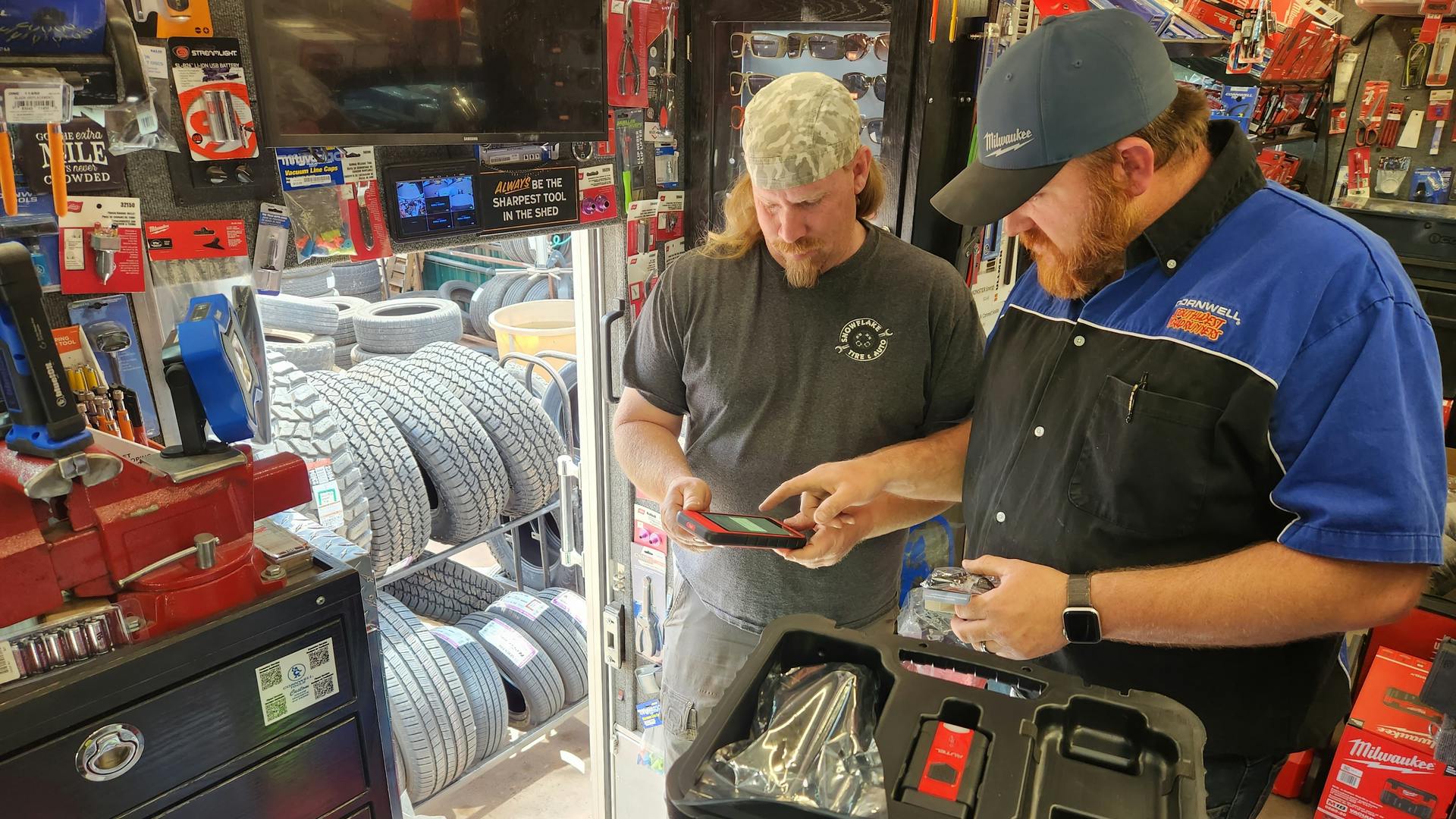 Cornwell Quality Tools Distributor Frank Orphey assisting a customer on his tool truck