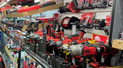 a variety of Mac Tools power tools and accessories on a shelf on a tool truck