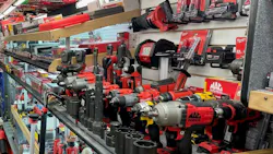 a variety of Mac Tools power tools and accessories on a shelf on a tool truck a variety of Mac Tools power tools and accessories on a shelf on a tool truck