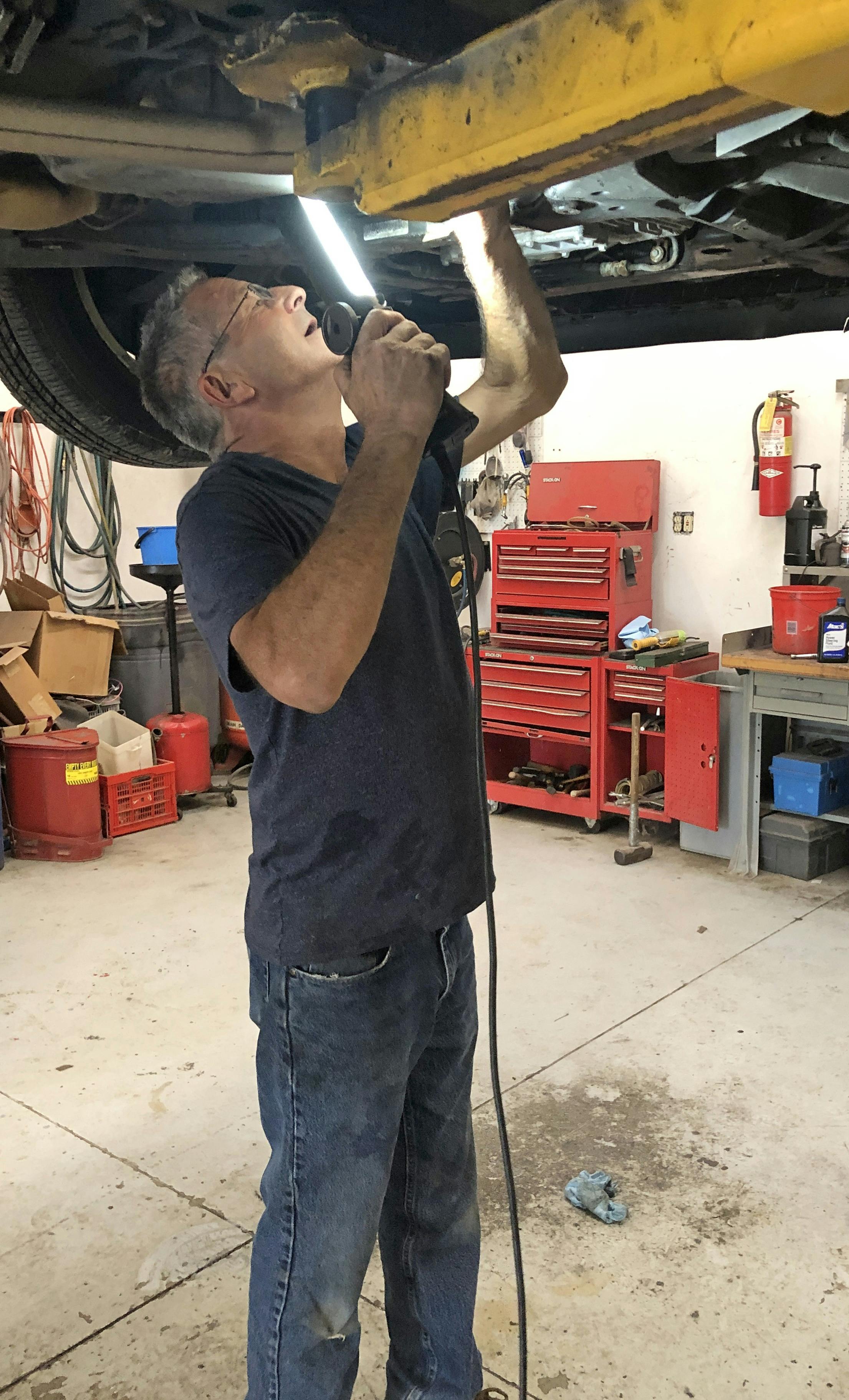 When standing work under a vehicle, try to avoid awkward positions where your back is bent. Granted, this is not always avoidable, but working at an awkward angle can lead to back strain. Try to reduce overhead work when possible.