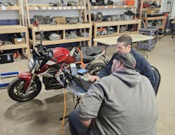 These technicians also work on motorcycles. This Zero SR/F is all electric. These technicians also work on motorcycles. This Zero SR/F is all electric.