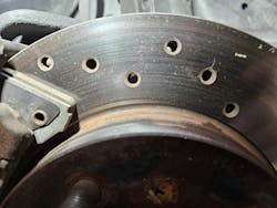 Stress cracking that formed due to excessive heat on a cross-drilled brake rotor off a third generation Chevrolet Camaro. Cross drilled rotors do a good job removing gas from the rotor surface but are not ideal for heavy prolonged usage where slotted rotors are better suited. Stress cracking that formed due to excessive heat on a cross-drilled brake rotor off a third generation Chevrolet Camaro. Cross drilled rotors do a good job removing gas from the rotor surface but are not ideal for heavy prolonged usage where slotted rotors are better suited.