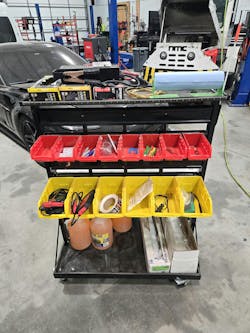 Figure 5 — The inspection cart is stocked with tablets, flashlights, mirror tools, and safety gear to perform vehicle inspections. Figure 5 — The inspection cart is stocked with tablets, flashlights, mirror tools, and safety gear to perform vehicle inspections.