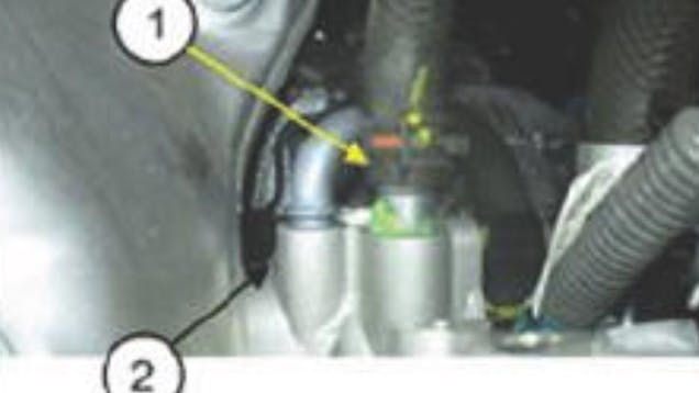 1) Coolant pipe; 2) housing.