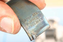 Depending on application, rod bearings may or may not be labeled for position, but be sure to check. Shown here is an upper rod bearing featuring standard thickness (note absence of marking 1X). Upper/lower bearing inserts may feature slightly different profiles, so don’t mix them up. Depending on application, rod bearings may or may not be labeled for position, but be sure to check. Shown here is an upper rod bearing featuring standard thickness (note absence of marking 1X). Upper/lower bearing inserts may feature slightly different profiles, so don’t mix them up.