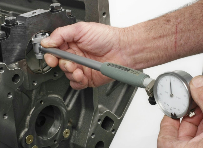 With main bearings and main caps fully installed, the bore gauge is used to measure installed bearing inside diameter. The different in the reading indicates oil clearance. Take the reading at 12 and 6 o’clock positions. Do not measure near/at the parting line.