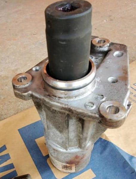Using bearing tool J-06133-A, press the bearing from the housing. Position the new bearing to the housing. Using bearing tool J-41736, press the bearing into the housing until seated. Install a new ring.
