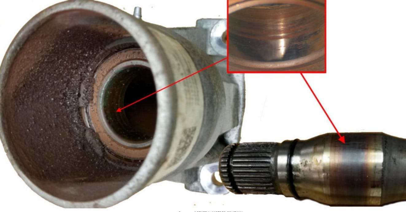 Using the tool, remove the front wheel drive intermediate shaft from the differential carrier.
