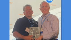 Kunz accepts his award Kunz accepts his award